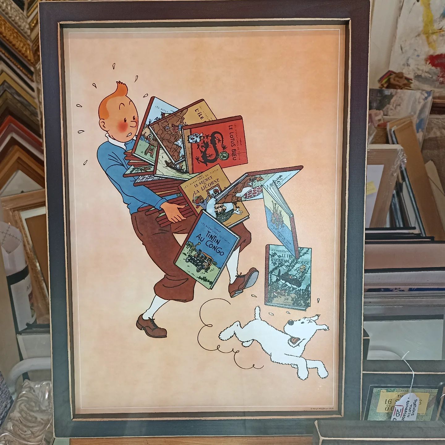 Tintín y sus libros en equilibrio.